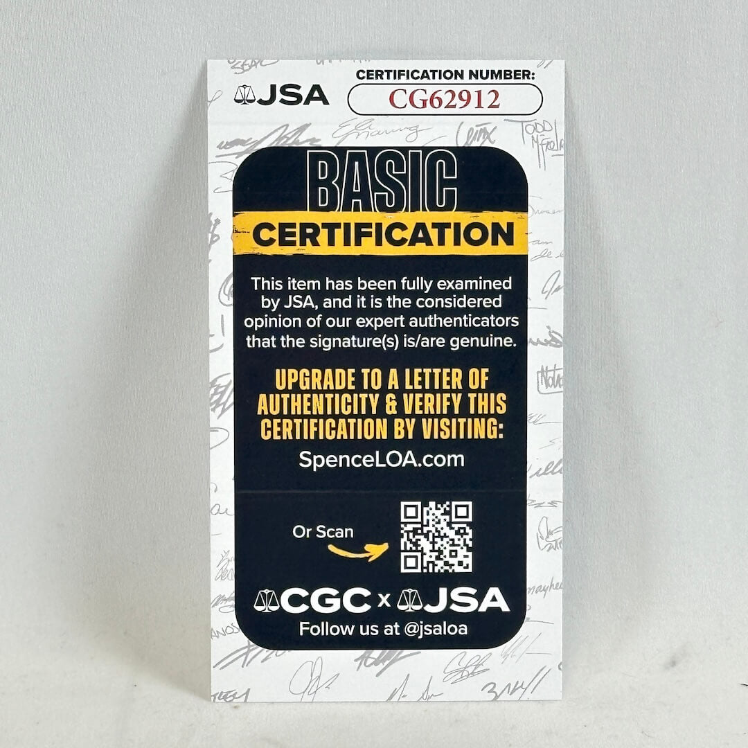 JSA basic certification card photographed against white surface. 