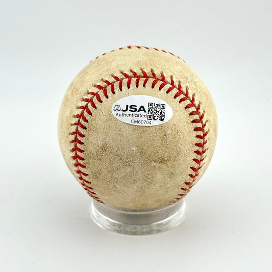 Baseball with JSA authentication label on a white background