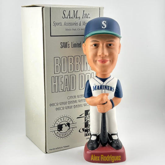 Bobblehead figure of a baseball player in a Mariners uniform with packaging in the background.