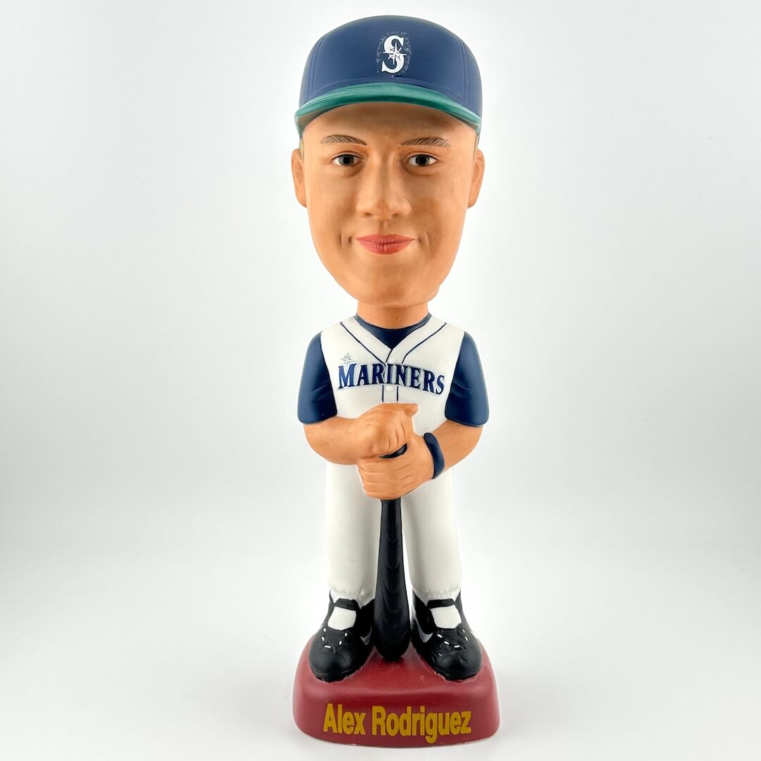 Bobblehead figure of a baseball player in a Mariners uniform on a white background