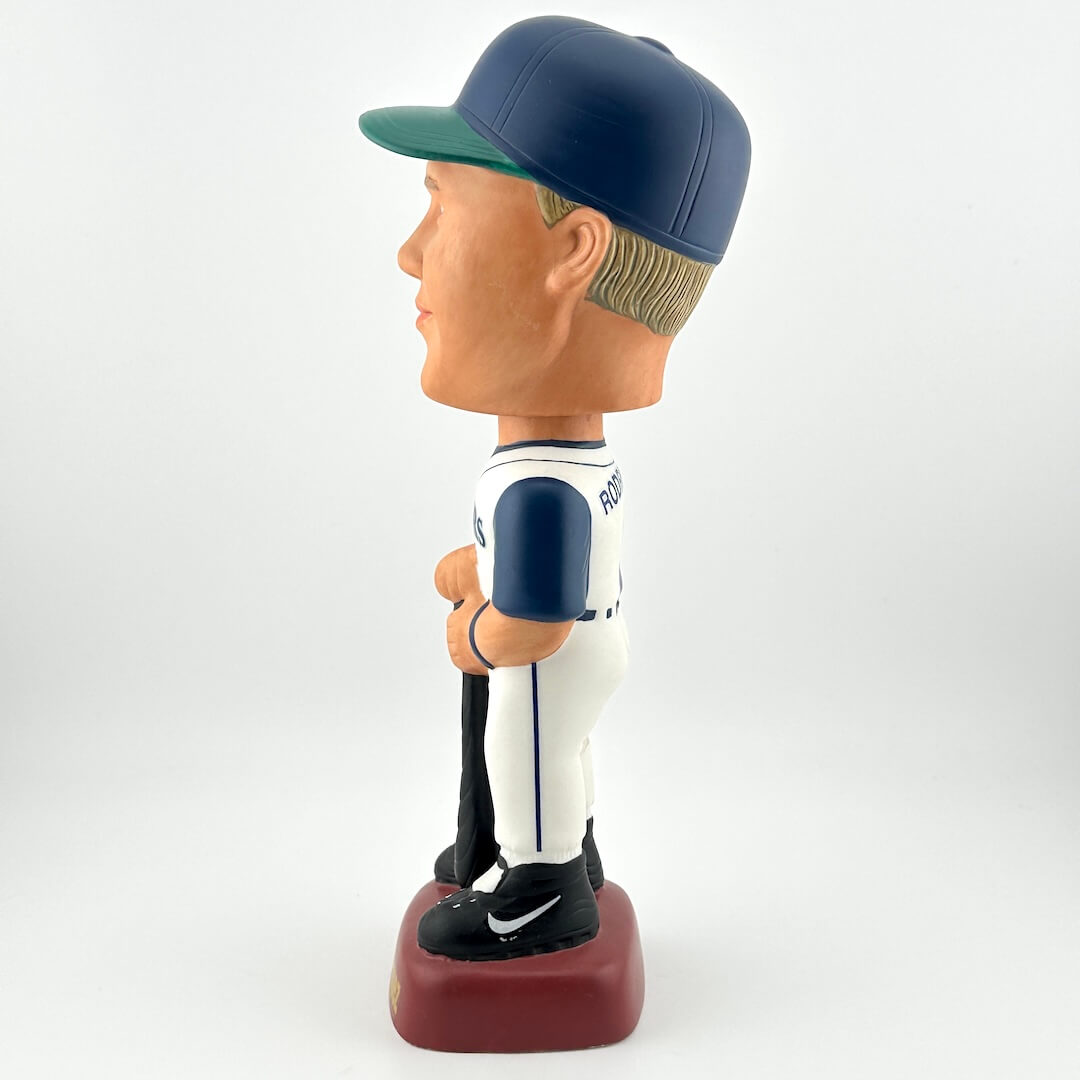 Bobblehead figure of a baseball player in a white uniform with blue accents on a white background