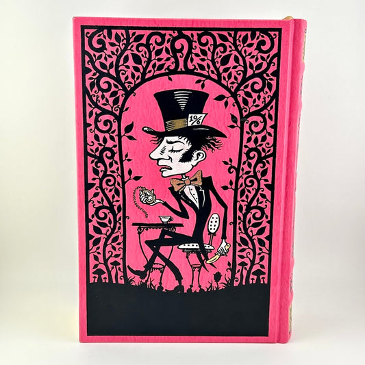 Book with a pink cover featuring a design of a man in a top hat and bow tie against a black background.
