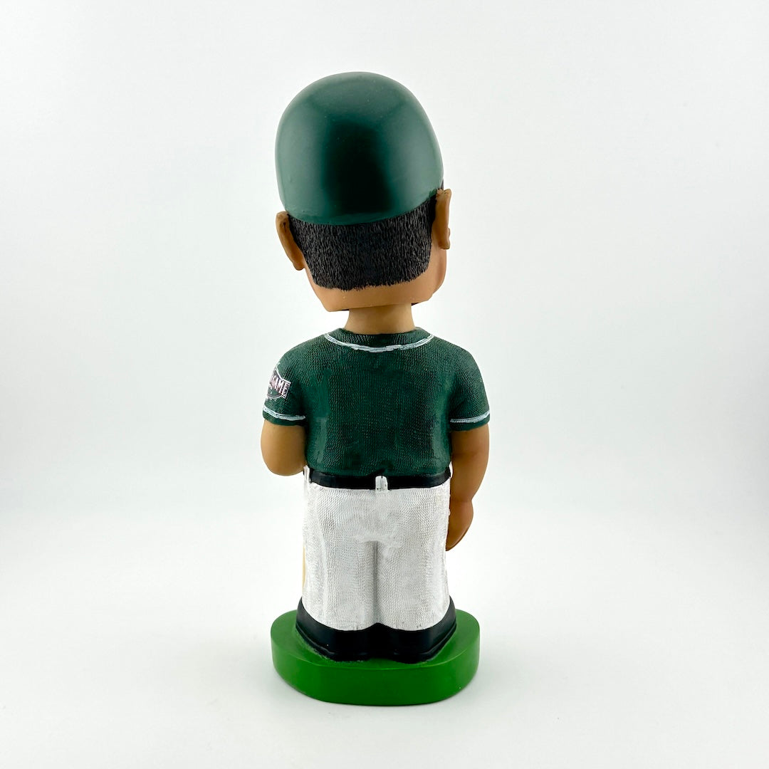 Bobblehead figure of a sports player in green uniform on a white background