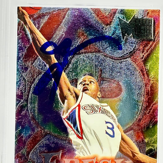 Basketball player in action with colorful abstract background and signature above head. 