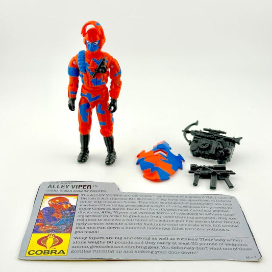 Toy figure of Alley Viper with accessories and card on a white background