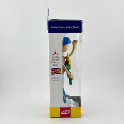 Boxed action figure with a blue helmet and yellow outfit on a white background