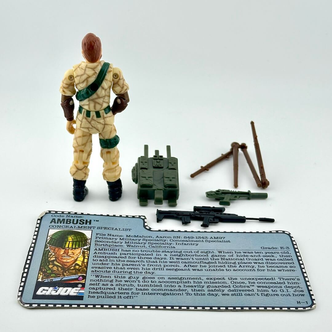 Toy figure with accessories and character card on a white background