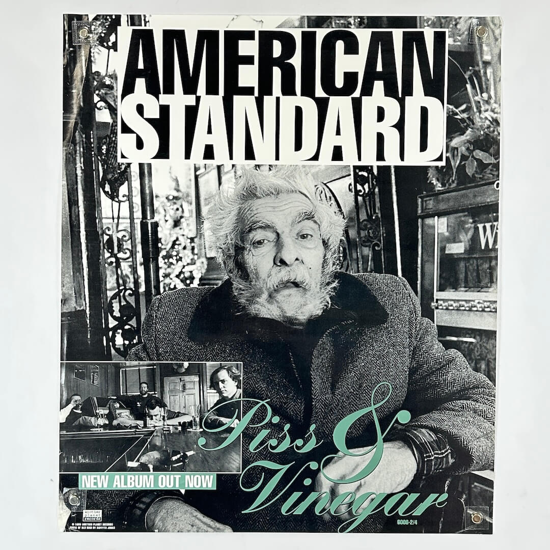 Album cover with a black and white photo of a person, text 'American Standard', and promotional text for 'Piss & Vinegar'.
