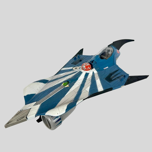 Navy and silver toy spaceship on gray background.