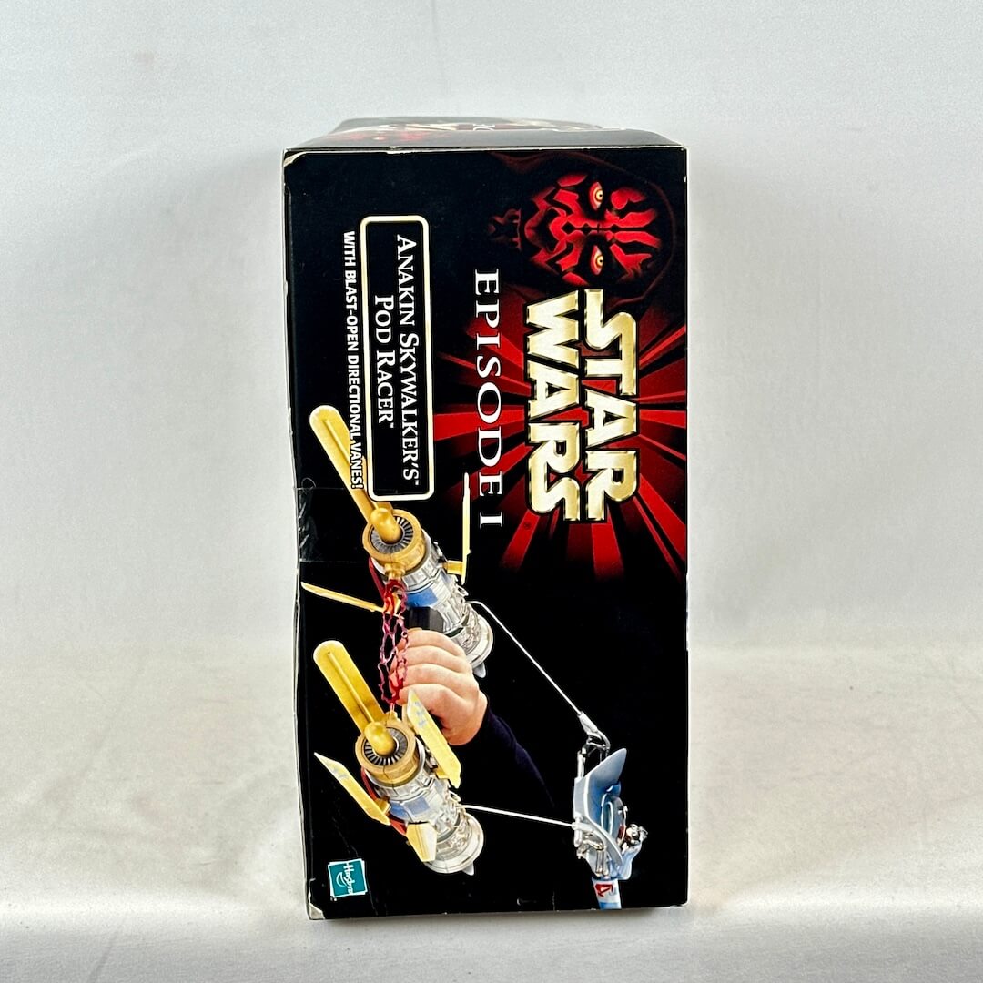 Star Wars toy box with Anakin's Pod Racer on a white background