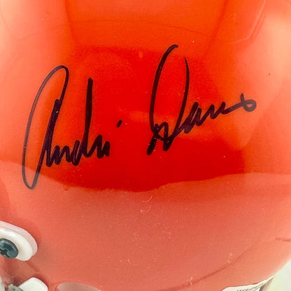 Close-up of a orange helmet with a signature on it