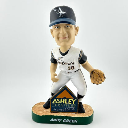Bobblehead of a baseball player with a branded base on a white background