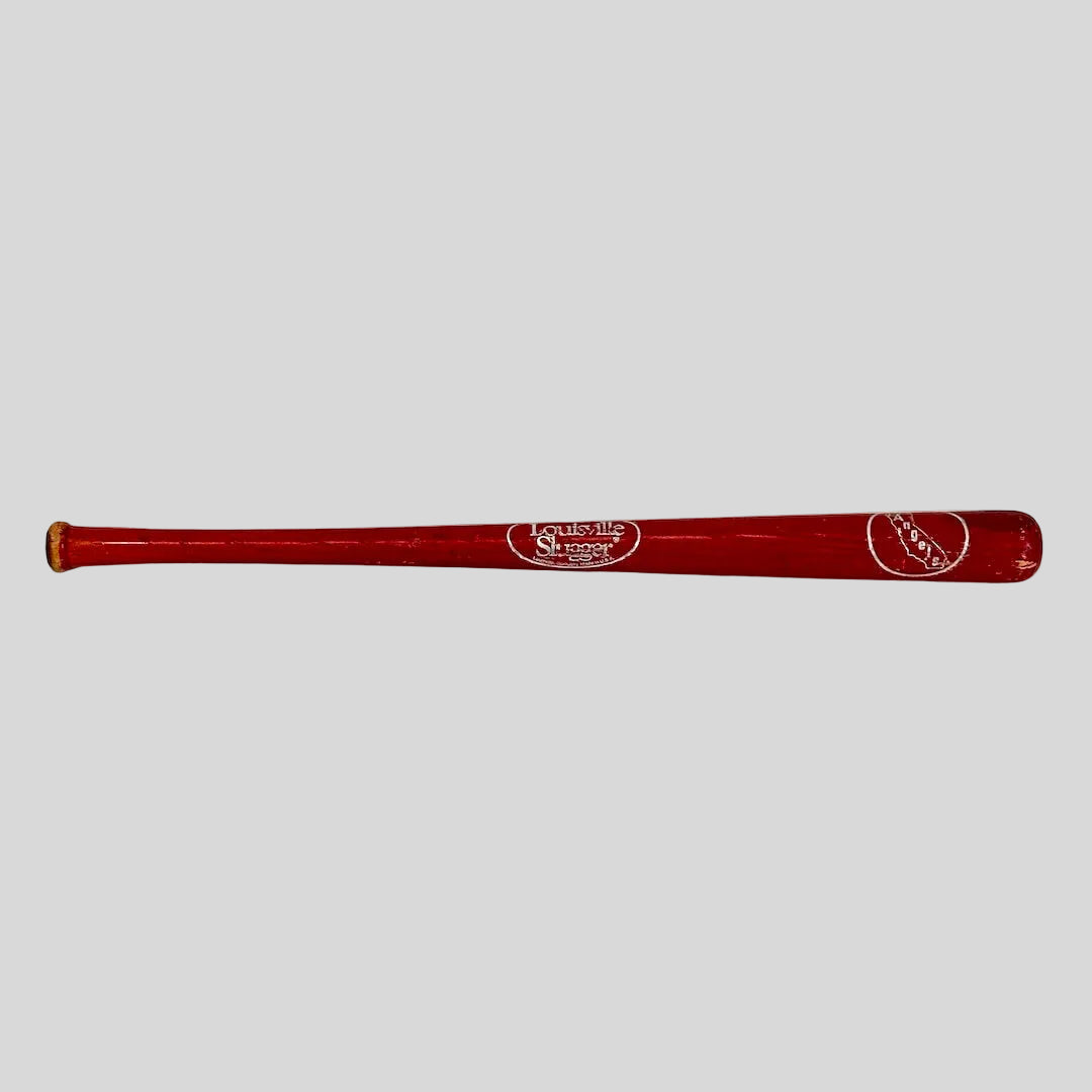 Red baseball bat with branding on a white background