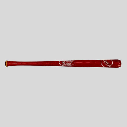 Red baseball bat with branding on a white background
