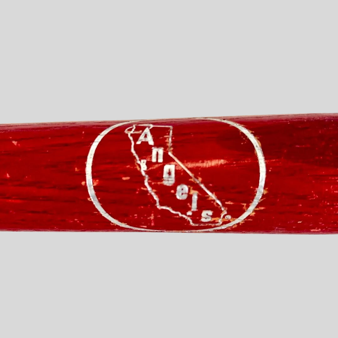 Red baseball bat with 'Angels' logo on a white background