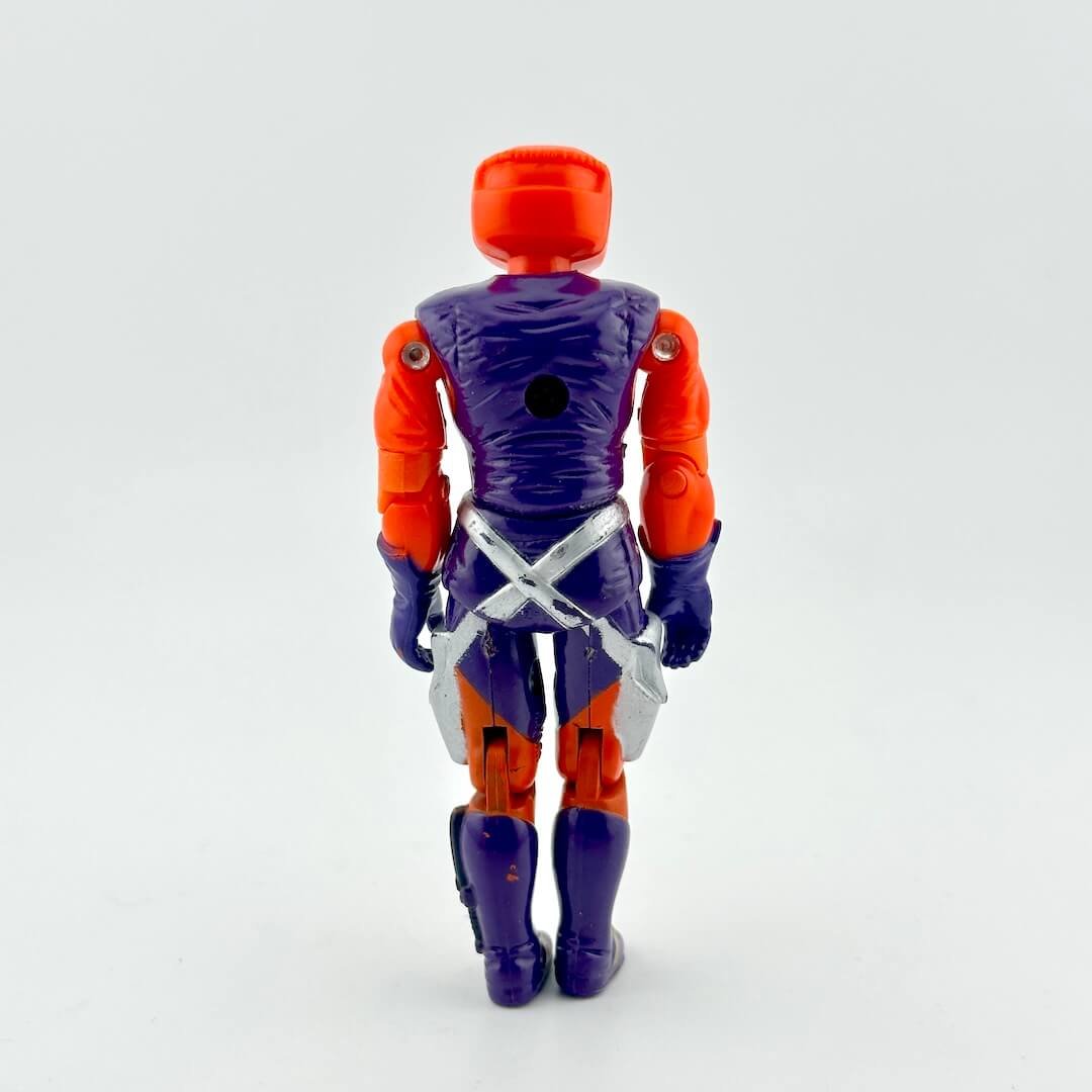 GI Joe action figure in orange and purple outfit with orange helmet, photographed on white background. 