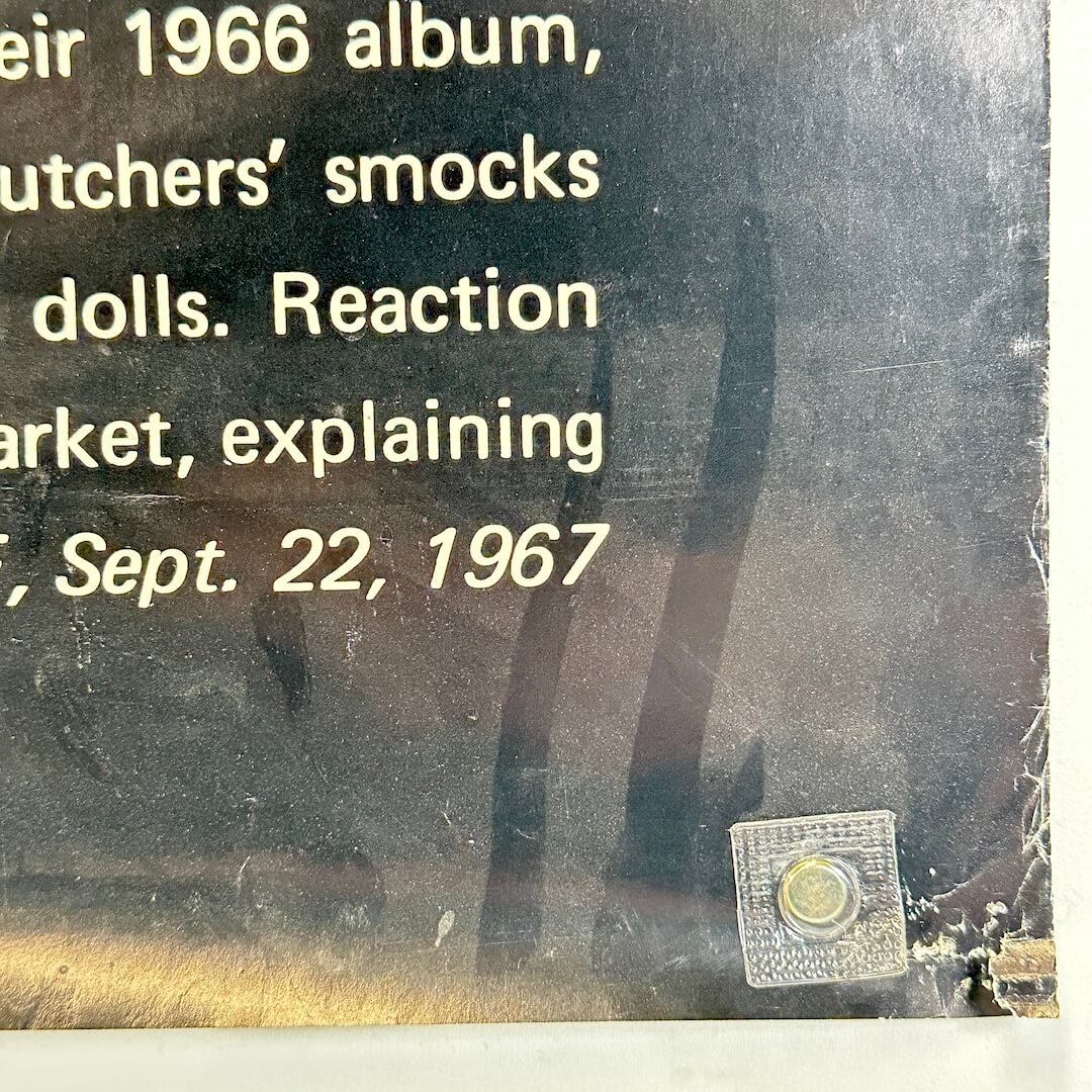 Bottom right corner of poster with wear to right edge and pin holes at corner. Dust visible. 
