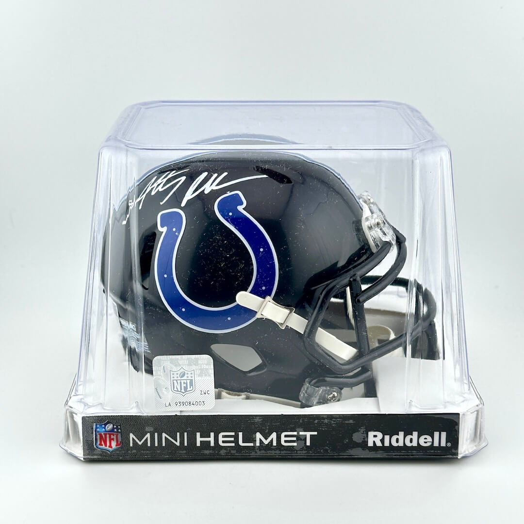 Riddell mini football helmet in clear packaging on a white background