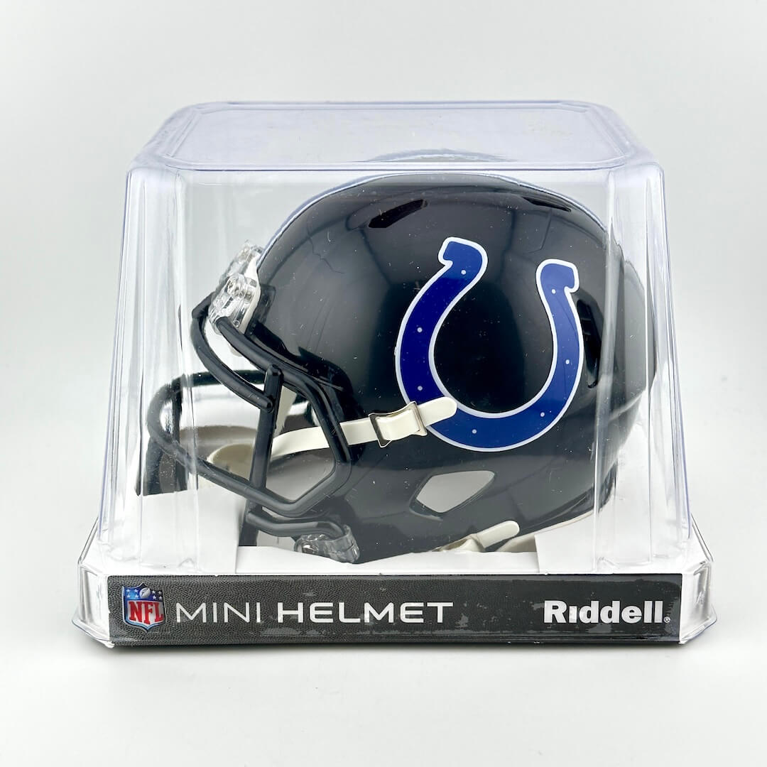 Riddell mini football helmet in clear packaging on a white background
