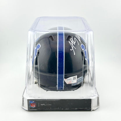 Black football helmet with autograph in a clear display case on a white background