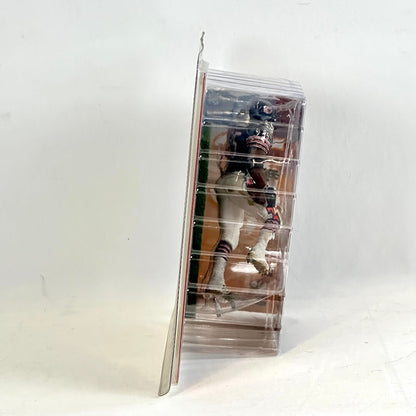 Toy figure in a clear plastic packaging on a white background