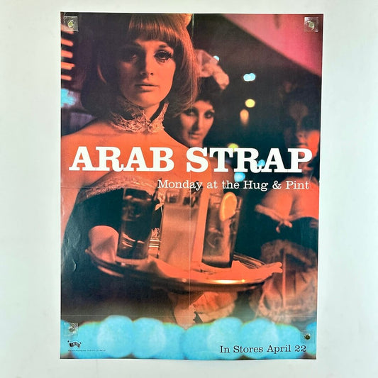 Album cover for 'Arab Strap' with a woman and drinks, featuring text about a release date.