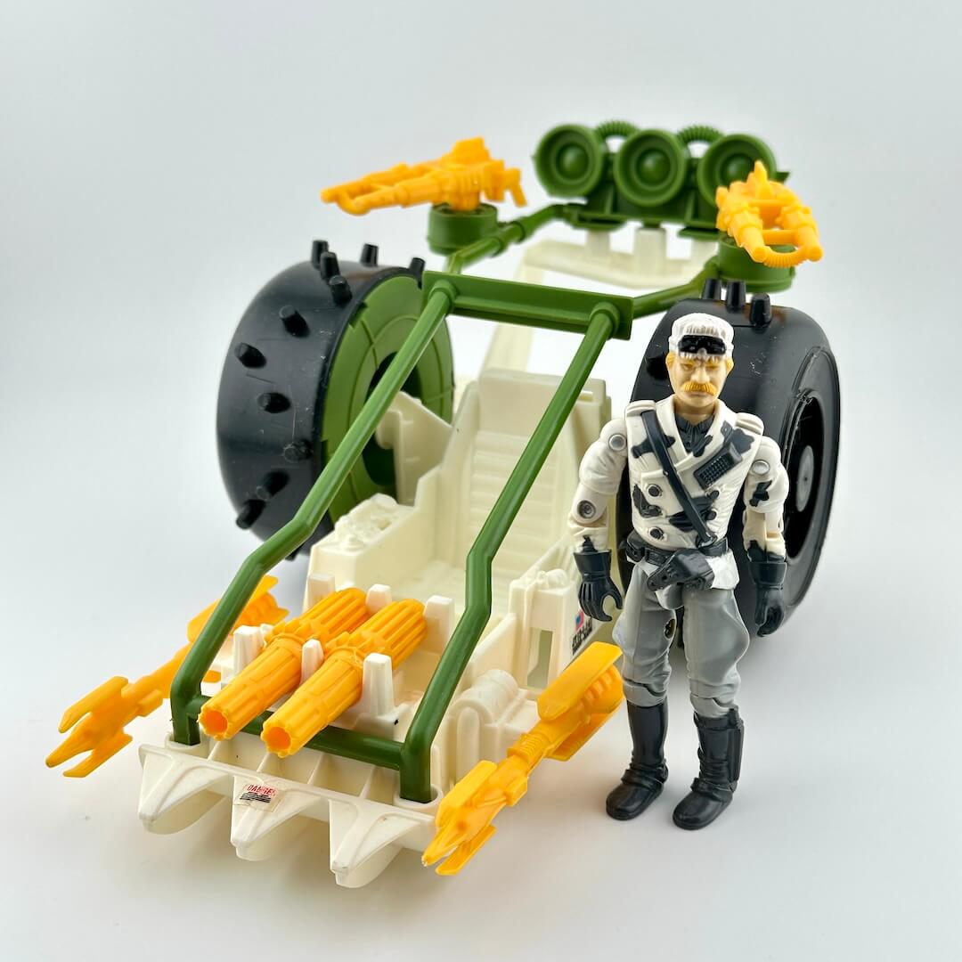 Toy figure with a vehicle and weapons on a white background