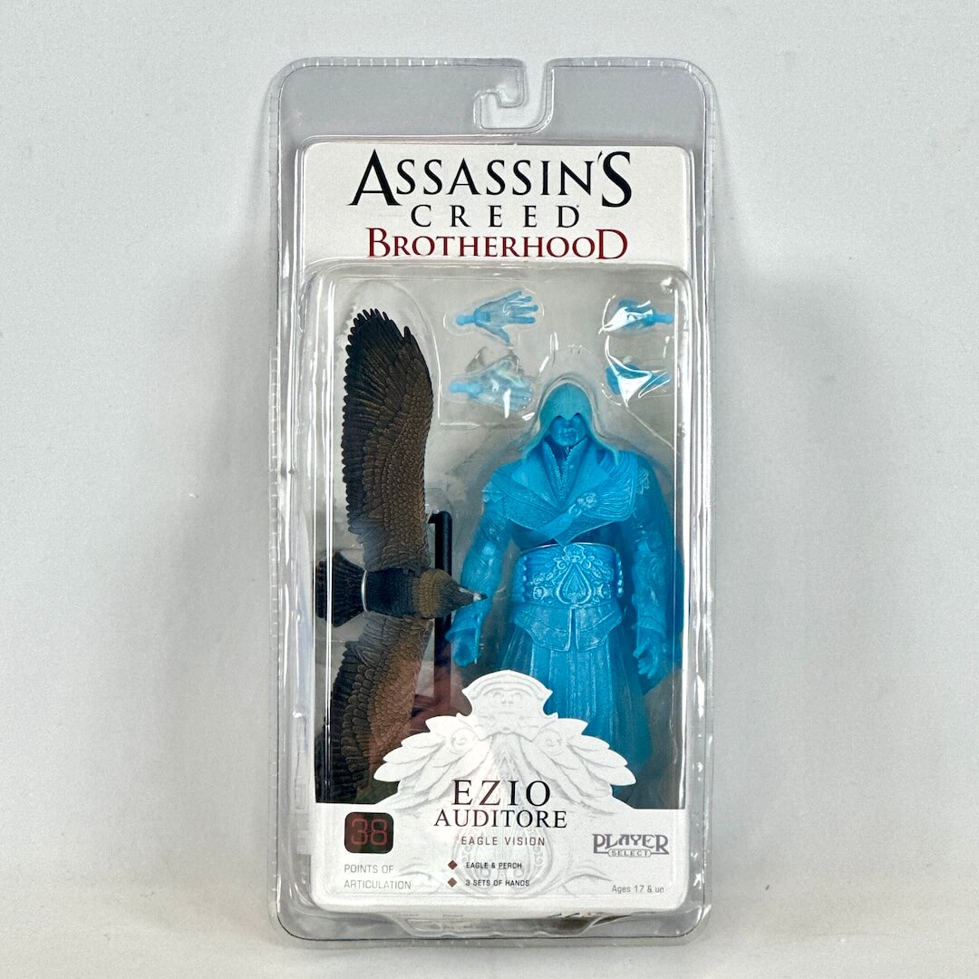 Assassin's Creed Brotherhood Ezio Auditore figure in packaging on a gray background