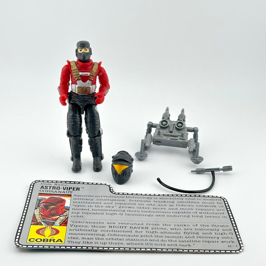 G.I. Joe action figure with accessories and character card against white background.
