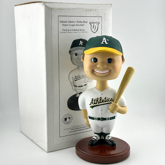 Bobblehead figure of a baseball player in an Oakland Athletics uniform with a box in the background.