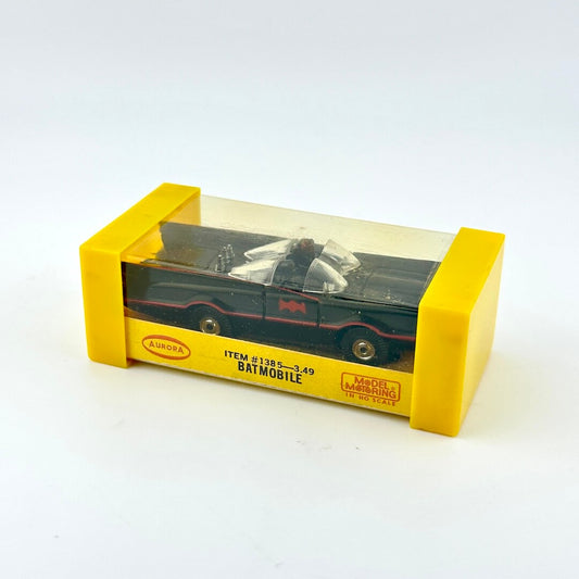 Model Batmobile in a yellow box on a white background