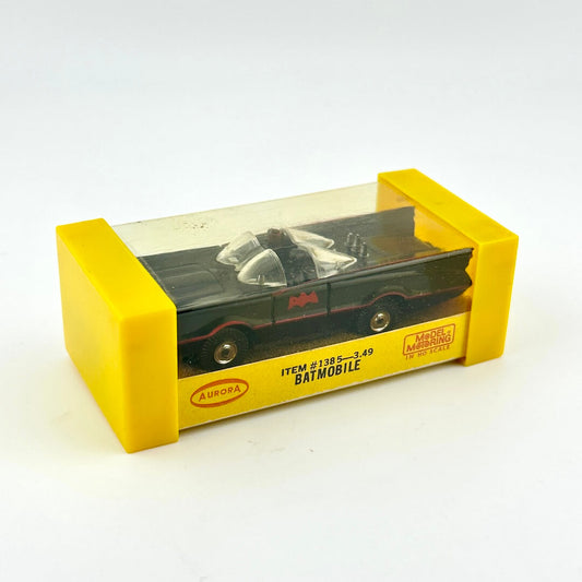 Model Batmobile in yellow packaging on a white background