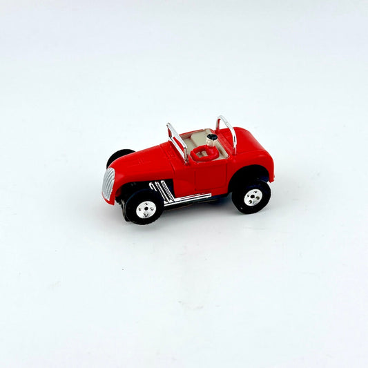 Red toy car on a white background