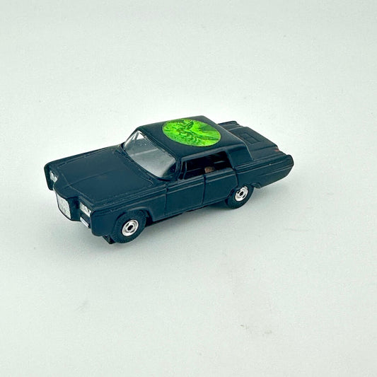 Model car with a green emblem on a white background