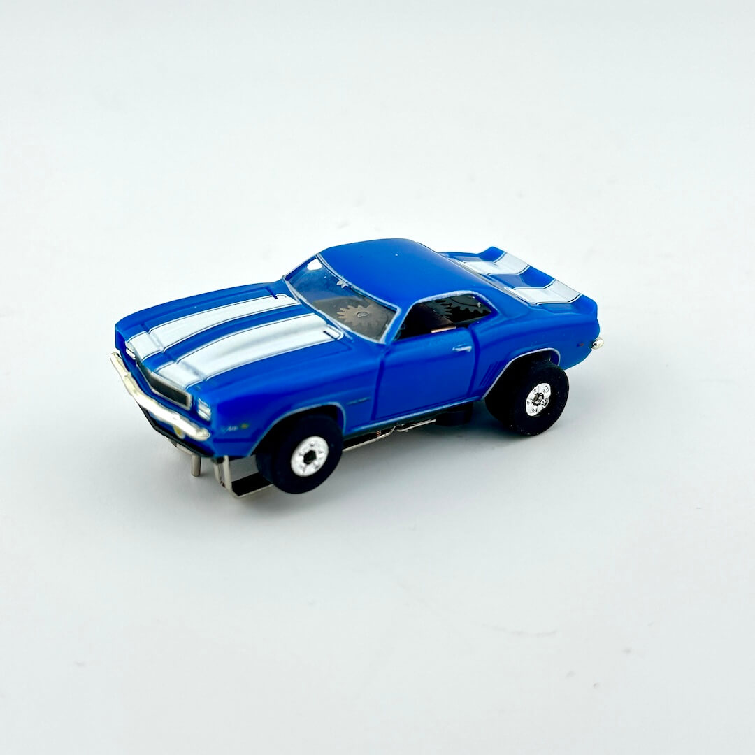Blue toy car with white stripes on a light gray background