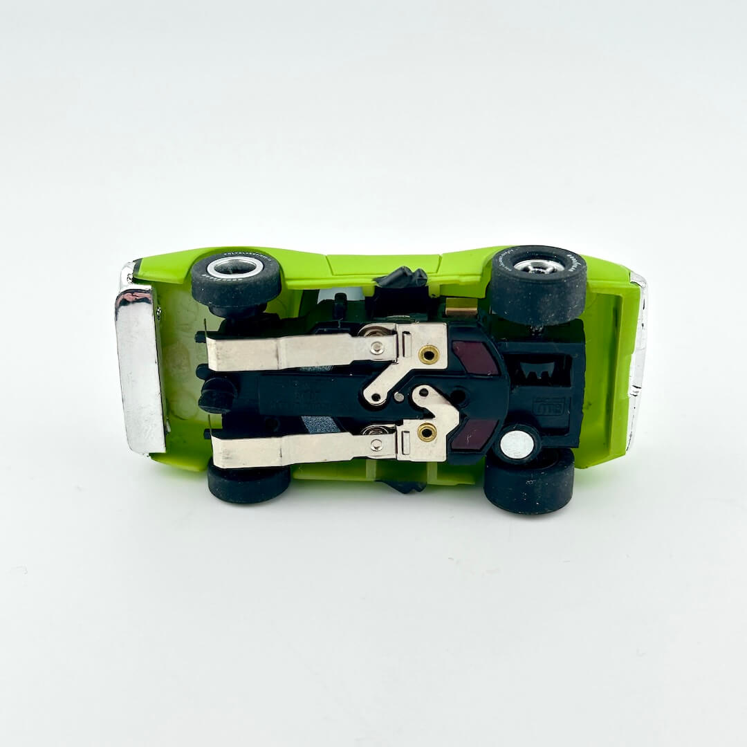 Underside view of slot car to show components. 