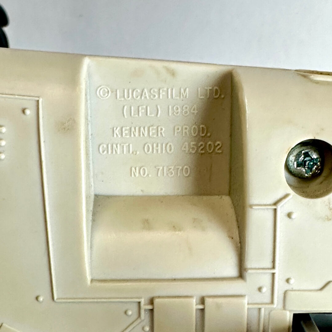 Close-up of the underside, showing embossed text reading '© LUCASFILM LTD. (LFL) 1984 KENNER PROD.