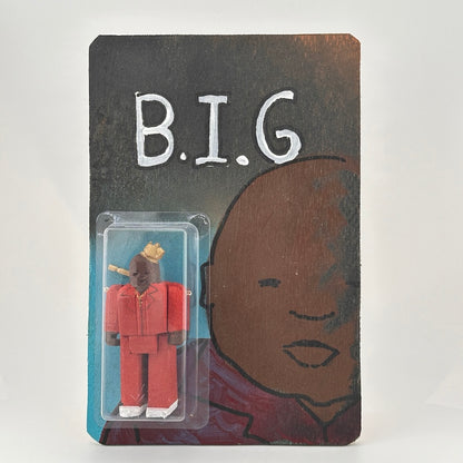 Custom hand-carved and hand-painted Notorious B.I.G. figure by Edwin Salas with 4 points of articulation and wooden card backer.