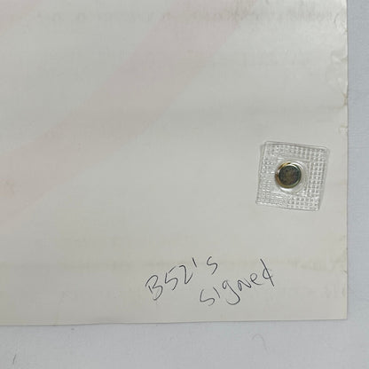 Backside corner where someone has written "B52's Signed" in pen. 