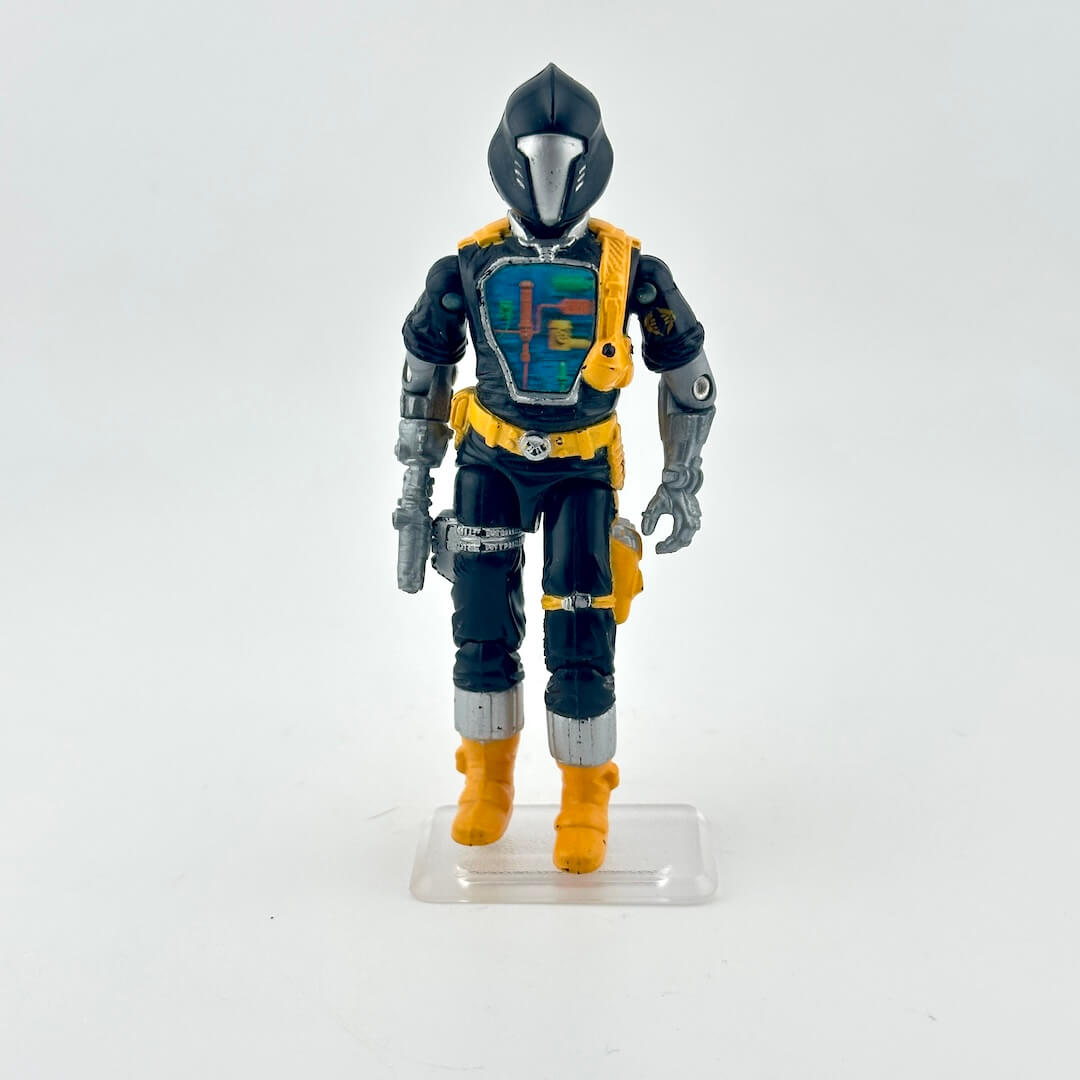 Toy figure in black and yellow outfit with helmet on a white background