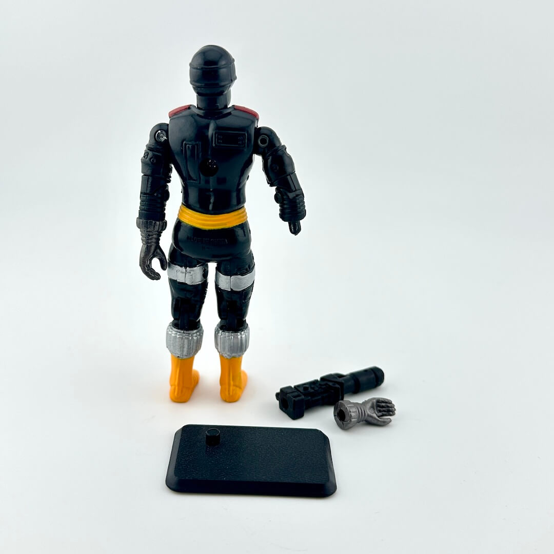 Black action figure with yellow accents on a white background