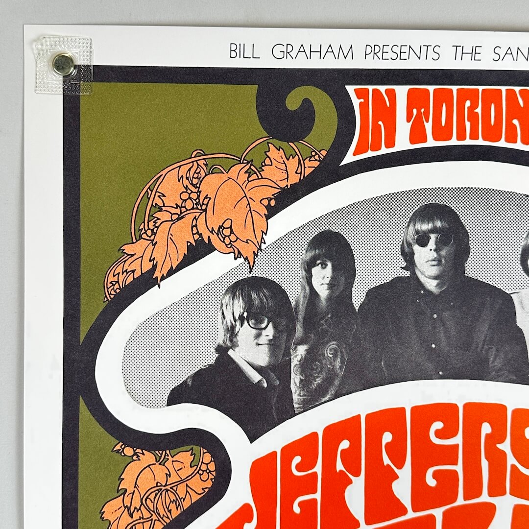 Top left corner of poster with no corner or edge wear visible. 