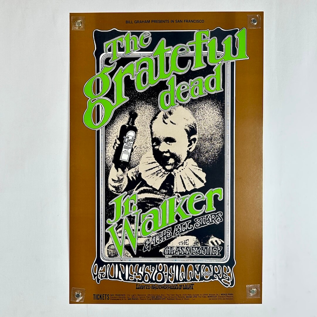 Vintage Grateful Dead poster with image of child holding a bottle of medicine in center and stylized text in green. 
