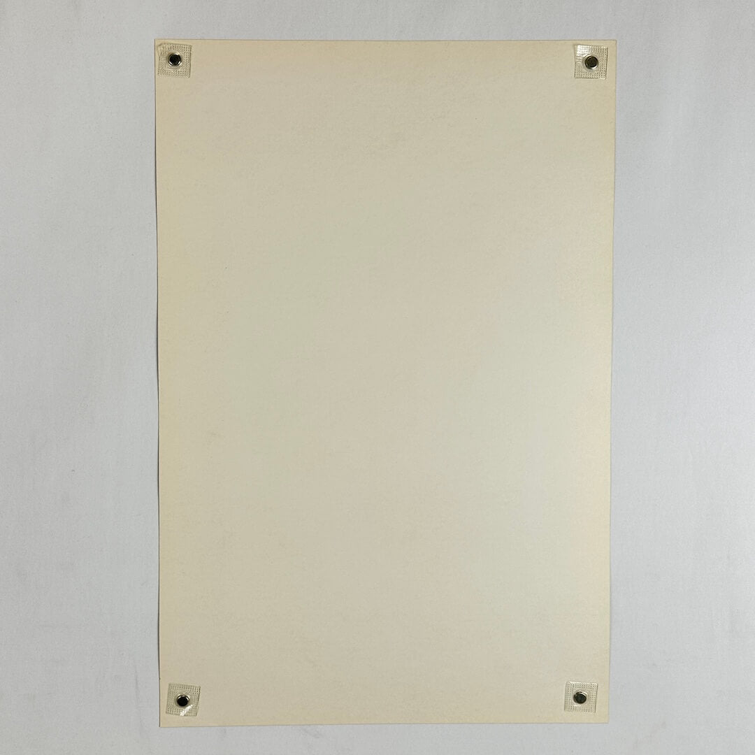 Backside of poster in mint condition being held by magnets in each corner on light gray background. 