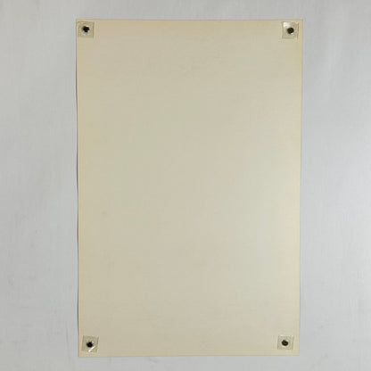 Backside of poster in mint condition being held by magnets in each corner on light gray background. 