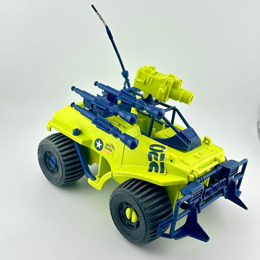 Toy vehicle with green and blue design on a white background