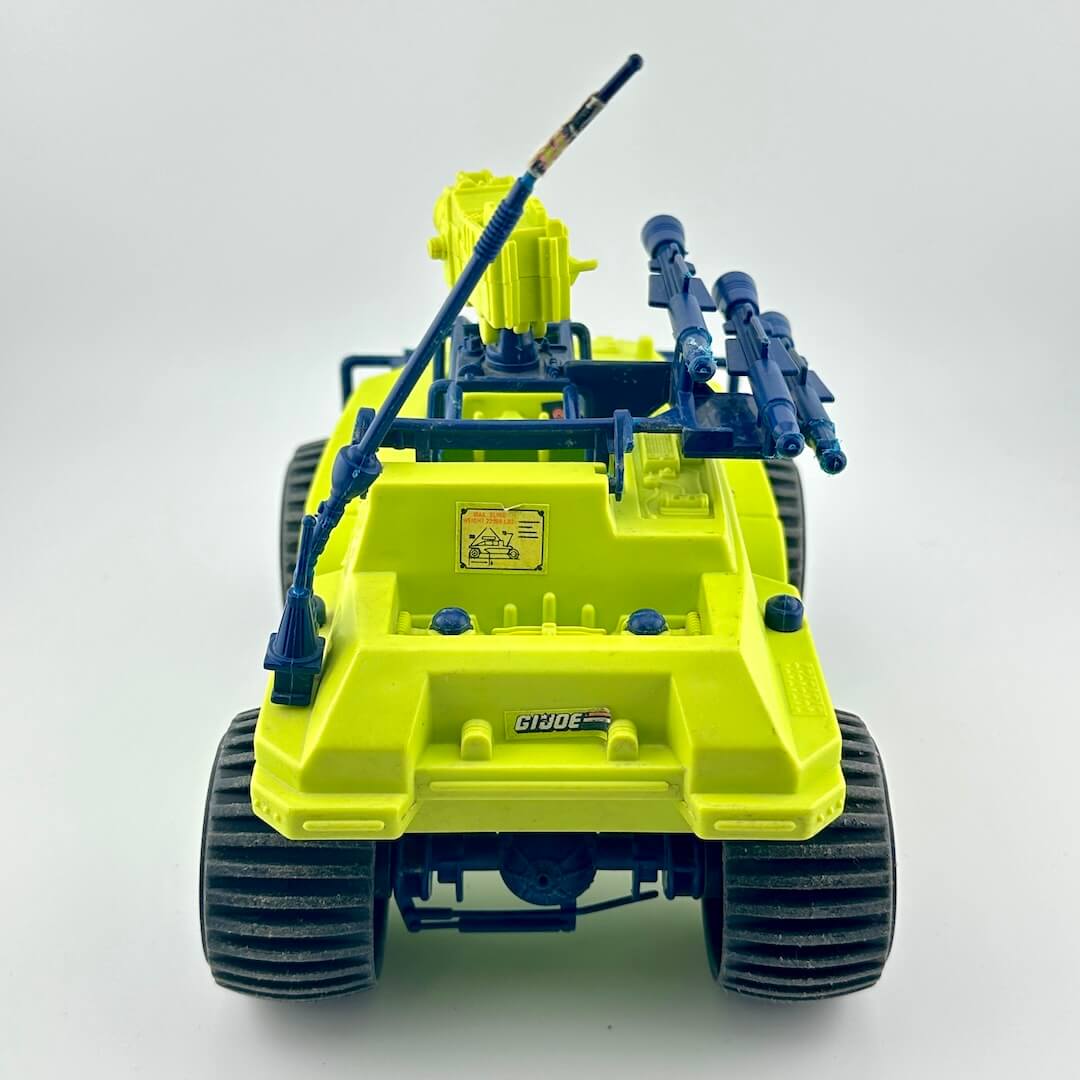 Toy vehicle with green and blue design on a white background