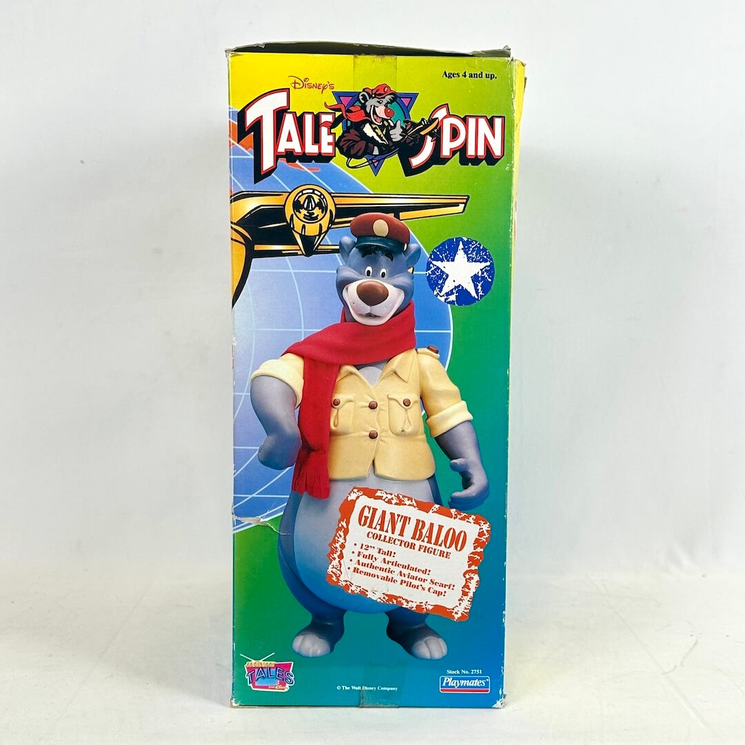 Toy figure packaging with character and 'TaleSpin' branding on a white background