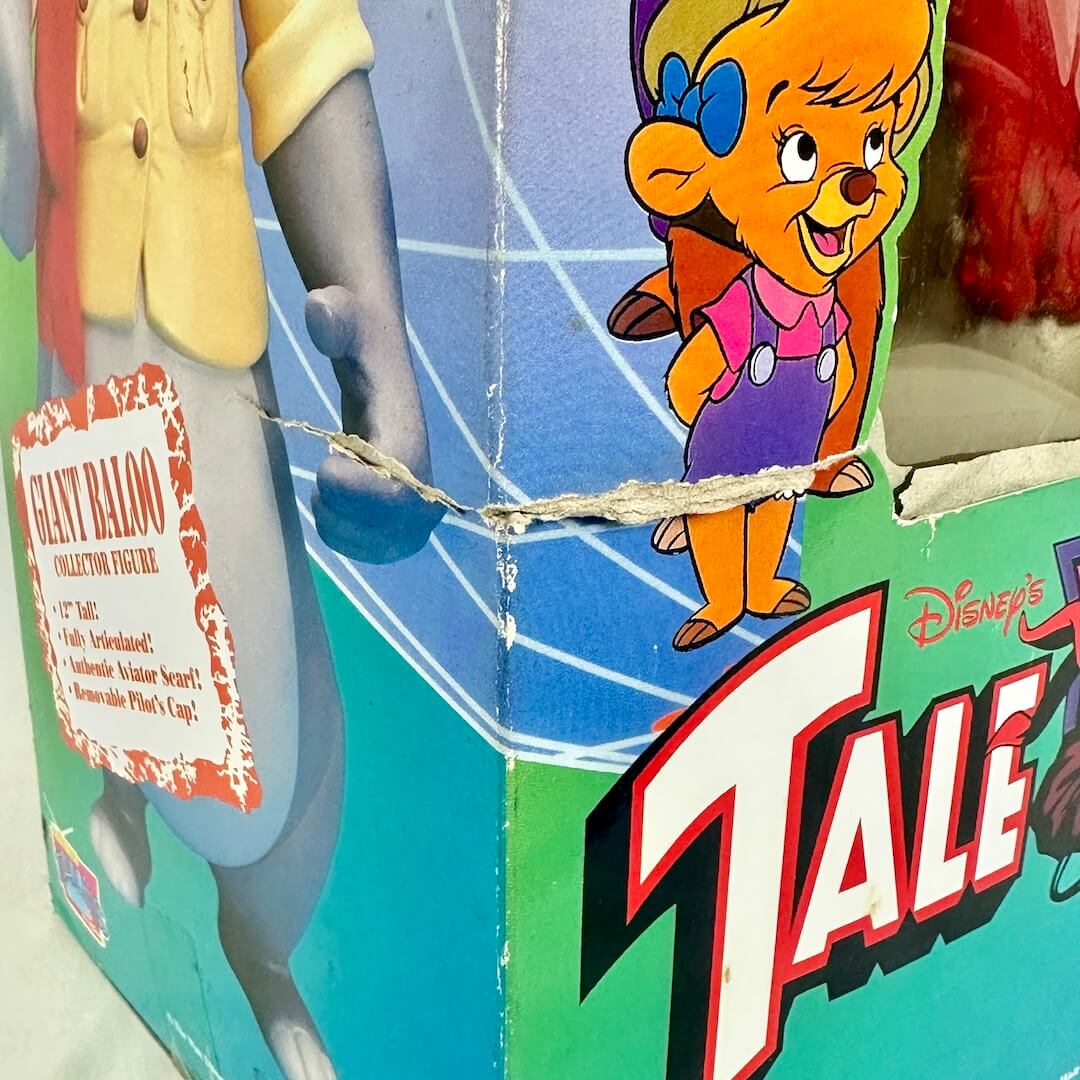 Toy figure packaging with a character and 'Tale Spin' branding