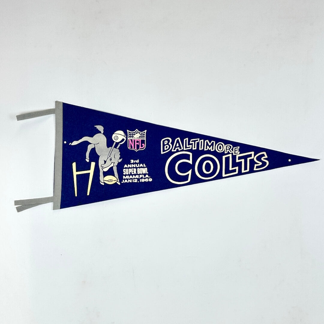 Vintage-style Baltimore Colts pennant with logo and text on a white background